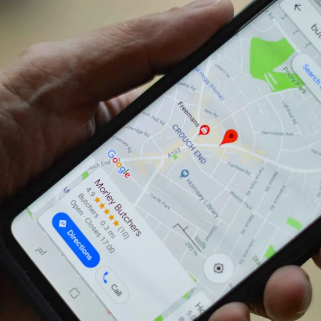 Smartphone displaying Google Maps with a highlighted local business, exemplifying the visibility achieved through 'Local SEO Services near me'."